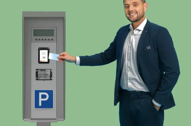 Man paying at Parking ticket machine